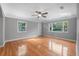 Cozy living room featuring gleaming hardwood floors, and large windows to let in the natural light at 829 Madison Ave, Daytona Beach, FL 32114