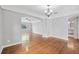 Open-concept living area with hardwood floors, large windows, and lots of natural light at 829 Madison Ave, Daytona Beach, FL 32114