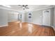 Inviting living room boasting hardwood floors, a ceiling fan, and a large window for sunlight at 829 Madison Ave, Daytona Beach, FL 32114