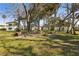 Lush community green space surrounded by mature trees and well-maintained buildings, perfect for outdoor enjoyment at 840 Center Ave # 9, Daytona Beach, FL 32117