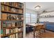 Bright dining area featuring built in banquette, shelving, and a beautiful wood table at 840 Center Ave # 9, Daytona Beach, FL 32117