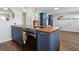 Spacious kitchen featuring a large island with butcher block counter and blue shaker cabinets at 840 Center Ave # 9, Daytona Beach, FL 32117