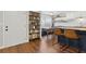 Open-concept kitchen featuring updated cabinets, breakfast bar, dining area, and hardwood floors at 840 Center Ave # 9, Daytona Beach, FL 32117