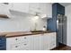 Kitchen featuring white shaker cabinets, butcher block counters and mosaic backsplash at 840 Center Ave # 9, Daytona Beach, FL 32117