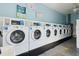 On-site laundry room featuring multiple washers for residents' convenience at 840 Center Ave # 9, Daytona Beach, FL 32117