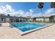 Refreshing community pool surrounded by lounge chairs, lush landscaping, and well-maintained building exteriors at 840 Center Ave # 9, Daytona Beach, FL 32117