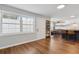 Well-lit room featuring hardwood floors, fresh paint, and a dining area at 840 Center Ave # 9, Daytona Beach, FL 32117
