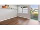 Bright, sunlit room featuring hardwood floors, fresh paint, and a view to the outside at 840 Center Ave # 9, Daytona Beach, FL 32117