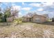 Backyard showing a house, shed, grass, and trees at 893 S Dean Cir, Deltona, FL 32738
