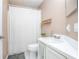 Cozy bathroom featuring a shower with curtain and a white vanity with sink at 893 S Dean Cir, Deltona, FL 32738