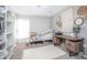 Comfortable bedroom featuring a bed, desk, and woven decorations at 893 S Dean Cir, Deltona, FL 32738
