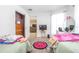 Bedroom featuring two beds, a closet, and access to the living room at 893 S Dean Cir, Deltona, FL 32738