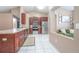 Well-lit kitchen with stainless steel appliances and sleek countertops overlooks the spacious living area at 893 S Dean Cir, Deltona, FL 32738