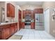 Stylish kitchen with stainless steel appliances, modern cabinetry, and white tile flooring at 893 S Dean Cir, Deltona, FL 32738