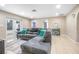 Comfortable living room with a plush sectional sofa and a view of the well maintained backyard at 893 S Dean Cir, Deltona, FL 32738