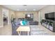 Inviting living room boasts neutral paint, recessed lights, and a comfortable sectional sofa at 893 S Dean Cir, Deltona, FL 32738