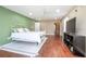 Spacious main bedroom features wood floors, ample lighting, and neutral paint colors at 893 S Dean Cir, Deltona, FL 32738