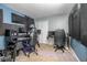 Home office features ample workspace, comfortable chairs, and a neutral color scheme at 893 S Dean Cir, Deltona, FL 32738