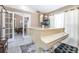 Bright room with grand white piano, and view to the inviting living room through open french doors at 893 S Dean Cir, Deltona, FL 32738