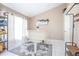Bright room with a grand white piano and white tile flooring, filled with natural light at 893 S Dean Cir, Deltona, FL 32738