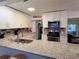 Well-appointed kitchen featuring granite countertops, white cabinetry and modern appliances at 906 E Wisconsin Ave, Deland, FL 32724