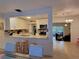 View showcasing open layout from the kitchen into the dining and living areas, perfect for entertaining at 906 E Wisconsin Ave, Deland, FL 32724