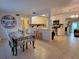 View showcasing open layout from the kitchen into the dining and living areas, perfect for entertaining at 906 E Wisconsin Ave, Deland, FL 32724