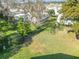 Expansive back yard with mature landscaping and lush green grass at 907 Rose Ln, The Villages, FL 32159