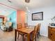 Cozy dining room featuring wooden table set and stylish pendant lighting at 907 Rose Ln, The Villages, FL 32159