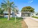 Charming single-story home with a covered carport and well-maintained lawn at 907 Rose Ln, The Villages, FL 32159