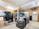 Garage with workbench and storage cabinets providing ample space for projects and tools at 907 Rose Ln, The Villages, FL 32159