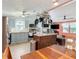 Spacious kitchen with stainless steel appliances, an island and light blue cabinets at 907 Rose Ln, The Villages, FL 32159