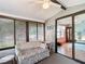 A relaxing sunroom with a comfortable floral sofa has a view of the living room at 907 Rose Ln, The Villages, FL 32159