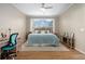 Comfortable bedroom featuring a cozy bed, desk, and warm lighting at 9580 Sw 71St Loop, Ocala, FL 34481