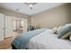 Relaxing bedroom showcasing an en-suite bathroom, cozy linens, and a study desk at 9580 Sw 71St Loop, Ocala, FL 34481