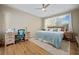 Bright bedroom with cozy bedding, a work station, and lots of natural light at 9580 Sw 71St Loop, Ocala, FL 34481