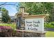 Stone Creek Golf Club & Grille sign with stone base, surrounded by greenery and landscaping at 9580 Sw 71St Loop, Ocala, FL 34481
