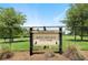 Stone Creek Reflection Bay Dog Park featuring a secure fenced area with mature trees and green space at 9580 Sw 71St Loop, Ocala, FL 34481
