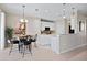 Bright eat-in kitchen with white cabinets and stainless steel microwave offers lots of storage space at 9580 Sw 71St Loop, Ocala, FL 34481