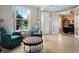 Bright living room with tiled floors, stylish furniture, and a view into the adjacent office space at 9580 Sw 71St Loop, Ocala, FL 34481