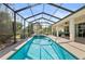 Relaxing screened-in pool with ample patio space for entertaining at 9580 Sw 71St Loop, Ocala, FL 34481