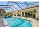 A stunning screened-in pool and patio area with ample space for outdoor living at 9580 Sw 71St Loop, Ocala, FL 34481