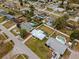 Aerial view of a home with a spacious, fenced backyard, neighboring homes with swimming pools in residential neighborhood at 1074 Abeline Dr, Deltona, FL 32725