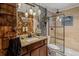 Charming bathroom with wood accents, granite countertops, and a glass-enclosed shower at 1074 Abeline Dr, Deltona, FL 32725