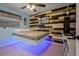 Modern bedroom features unique accent wall and floating bed with blue lighting at 1074 Abeline Dr, Deltona, FL 32725