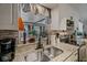 Close up of the kitchen sink with granite countertops and a view out the window at 1074 Abeline Dr, Deltona, FL 32725
