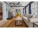 The living room has hardwood floors, a ceiling fan, and stylish decor at 1074 Abeline Dr, Deltona, FL 32725