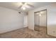Spacious bedroom featuring carpet, ceiling fan, and closet with mirror doors at 1117 Berkshire Rd, Daytona Beach, FL 32117