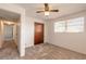 Cozy bedroom with a ceiling fan, closet, and neutral carpet at 1117 Berkshire Rd, Daytona Beach, FL 32117