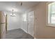 Bright dining area with a modern chandelier and wood-look flooring at 1117 Berkshire Rd, Daytona Beach, FL 32117
